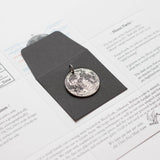 Fine silver double-sided full moon coin keychain - the perfect moon gift! Showing near side of the Moon.