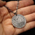 Fine silver double-sided full moon coin pendant necklace - the perfect moon gift! Showing far side of the Moon with black chain.