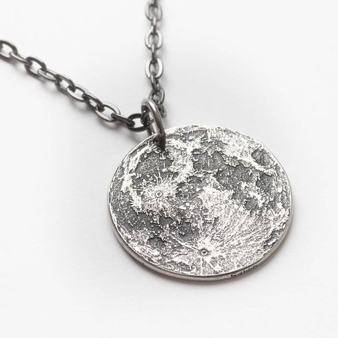 Fine silver double-sided full moon coin pendant necklace - the perfect moon gift! Showing near side of the Moon with black chain.