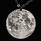 Fine silver double-sided supermoon full moon coin pendant necklace - the perfect moon gift! Showing near side of the Moon with black chain.