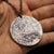 Fine silver double-sided supermoon full moon coin pendant necklace - the perfect moon gift! Showing far side of the Moon with black chain.