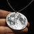 Fine silver double-sided supermoon full moon coin pendant necklace - the perfect moon gift! Showing near side of the Moon with black chain.