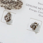 A cute pair of small genuine meteorite and sterling silver stud earrings - the perfect space meteorite jewelry gift for space-lovers!