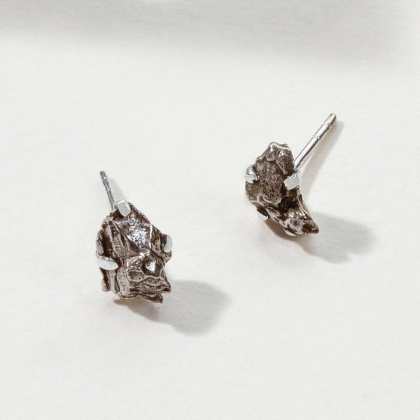 A cute pair of small genuine meteorite and sterling silver stud earrings - the perfect space meteorite jewelry gift for space-lovers!