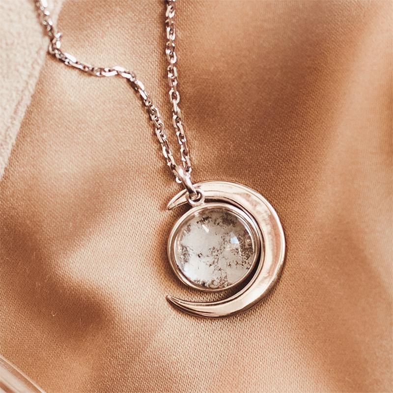 https://www.interstellarseller.com/cdn/shop/products/Sterling-Silver-Lunar-Meteorite-Necklace-Crescent-Moon-Dust-Necklace-glass-dome-space-lover-jewelry-gift-2.jpg?v=1661476982